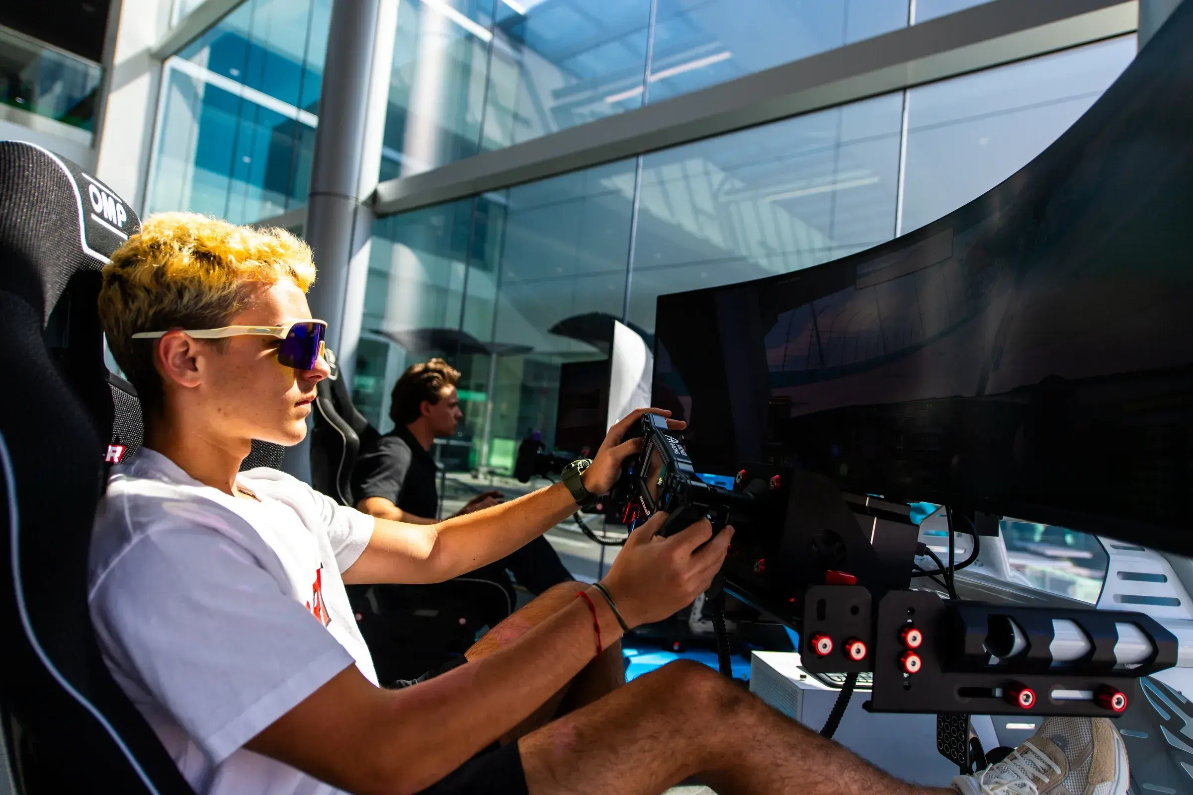 An attendee tests the racing simulator at Porsche West Broward in Miami.