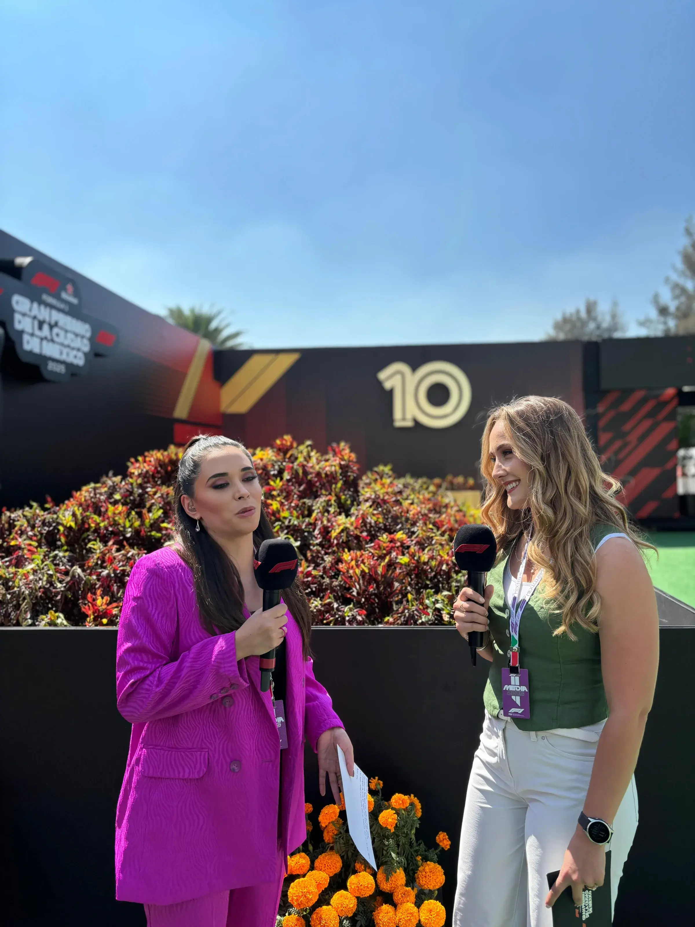 Sabré delivering live race commentary alongside her co-host at the 2025 F1 Mexico City Grand Prix
