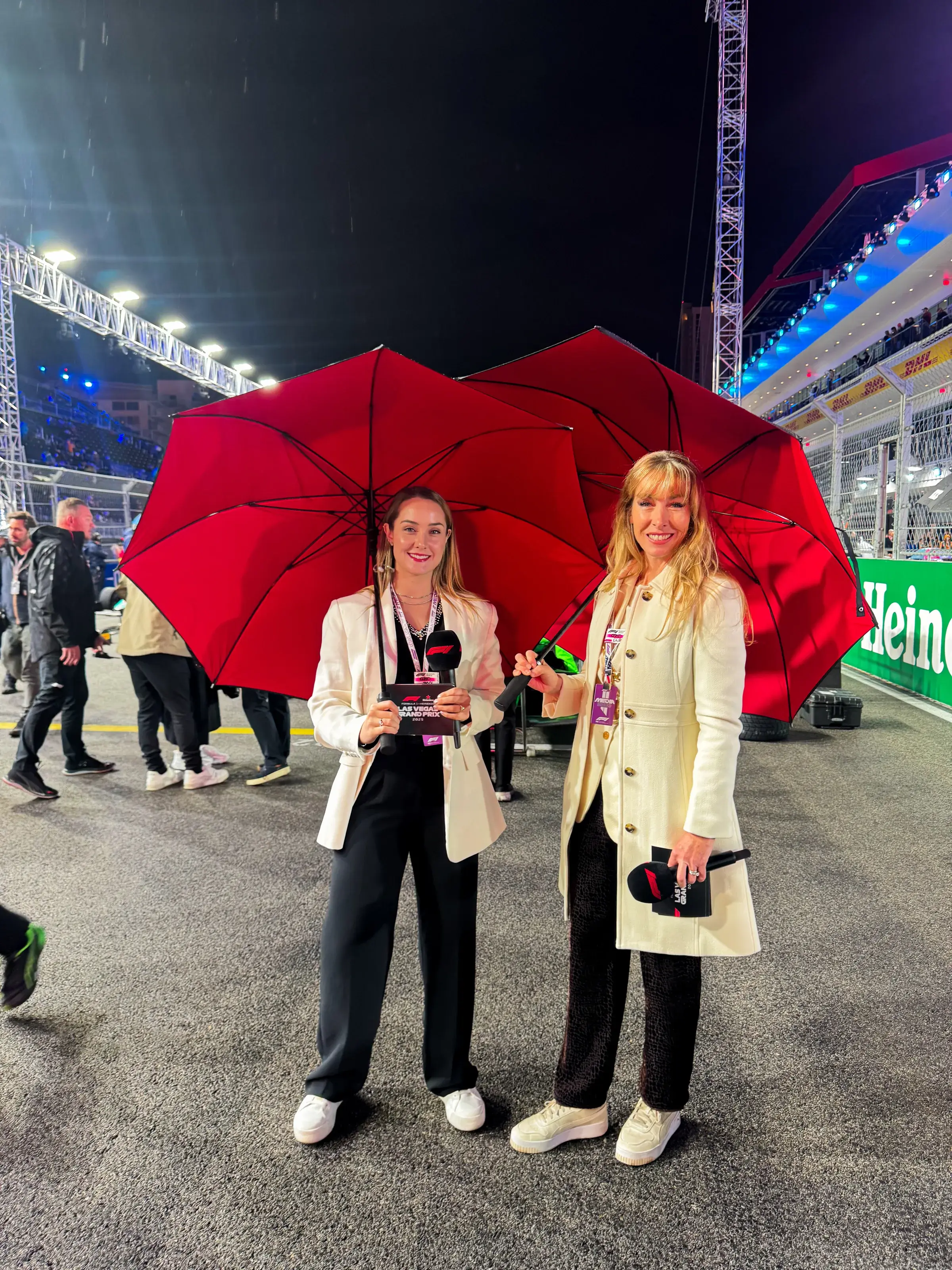 Sabré alongside her broadcast co-host during the 2025 F1 Las Vegas Grand Prix weekend