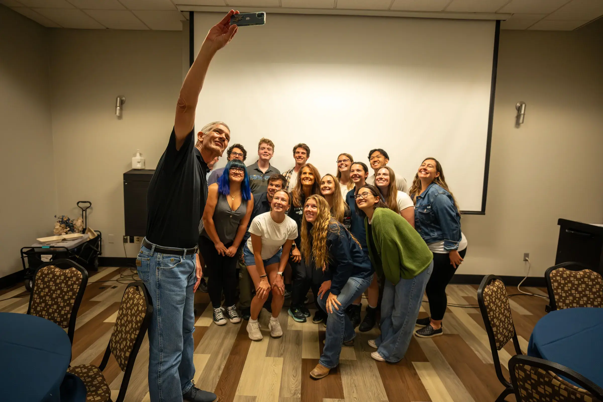 Paul C. Johnson and students take a selfie with Sabré at the Colorado School of Mines.