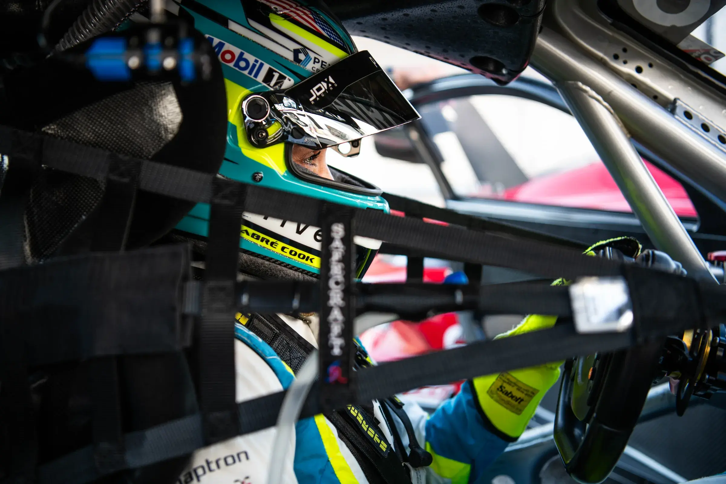 Sabré Cook inside of her Porsche 911 GT3 Cup car at the PMNA Indianapolis 2025 race weekend.